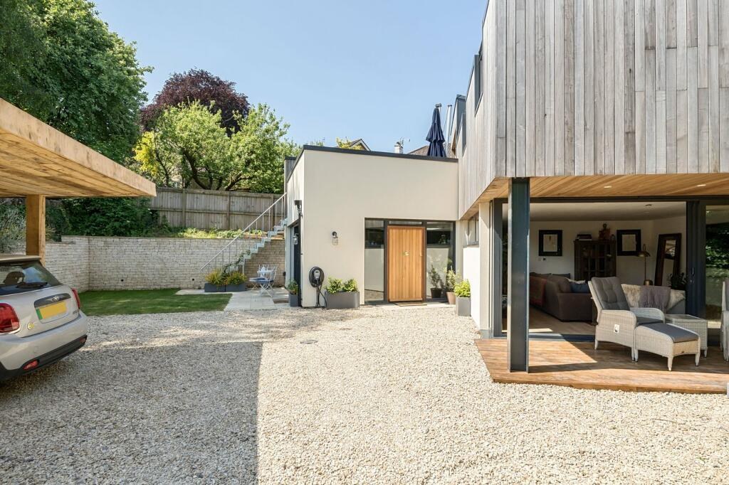 Hidden House completed around its private courtyard and parking area