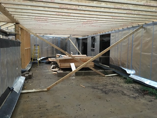 Timber structure being assembled at Hidden House